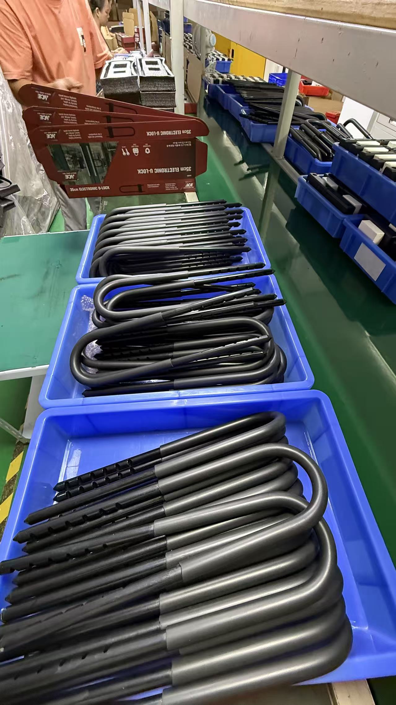 Finished metal components organized in production bins